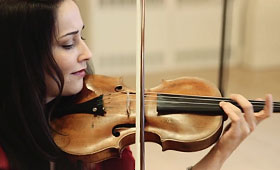 A close-up of Karla Donehew-Perez playing the violin.